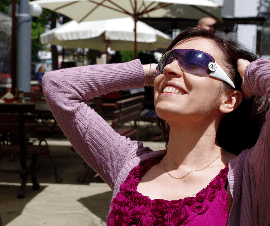 Woman enjoying the sunshine and her life because she is living her purpose